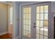 French doors open to a bright office with carpeted floors at 6865 Cowan Mill Rd, Winston, GA 30187