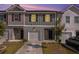 Two-story townhome with attached garage and landscaping at 3511 Lakeview Crk, Lithonia, GA 30038