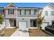 Two-story townhome with attached garage and landscaping at 3511 Lakeview Crk, Lithonia, GA 30038