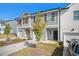 Two-story townhome with attached garage and landscaping at 3511 Lakeview Crk, Lithonia, GA 30038