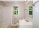 Clean bathroom with a bathtub, vanity, and window at 3523 Se Garfield Se Way, Atlanta, GA 30354