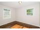 Bright bedroom with hardwood floors and two large windows at 3523 Se Garfield Se Way, Atlanta, GA 30354