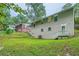 Side view of house showing gray siding and backyard at 700 Symphony Nw Ln, Atlanta, GA 30318