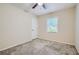 Spacious bedroom with ceiling fan and neutral carpeting at 700 Symphony Nw Ln, Atlanta, GA 30318