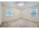 Spacious bedroom with neutral carpeting and large windows at 700 Symphony Nw Ln, Atlanta, GA 30318