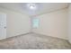 Well-lit bedroom with neutral walls and carpet at 700 Symphony Nw Ln, Atlanta, GA 30318