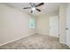 Spacious bedroom with ceiling fan and neutral carpeting at 700 Symphony Nw Ln, Atlanta, GA 30318