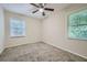 Well-lit bedroom with ceiling fan and neutral carpeting at 700 Symphony Nw Ln, Atlanta, GA 30318