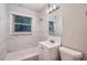 Clean bathroom with marble tile and white vanity at 700 Symphony Nw Ln, Atlanta, GA 30318