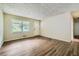 Large living room with wood-look floors at 700 Symphony Nw Ln, Atlanta, GA 30318