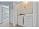 Laundry room with washer, dryer, and shelving at 10 Argyll Way, Covington, GA 30014
