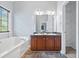Double vanity bathroom with soaking tub at 10 Argyll Way, Covington, GA 30014