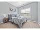 Cozy bedroom with a queen-size bed and window at 10 Argyll Way, Covington, GA 30014