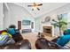 Living room with fireplace and leather sofas at 10 Argyll Way, Covington, GA 30014