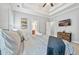 Main bedroom with a king-size bed and large TV at 10 Argyll Way, Covington, GA 30014