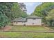 Rear view of charming light beige brick house at 1123 Redan Way, Stone Mountain, GA 30088