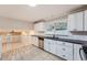 Kitchen with white cabinets, granite countertops, and stainless steel appliances at 1123 Redan Way, Stone Mountain, GA 30088