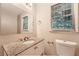 Clean bathroom with granite vanity and updated fixtures at 1123 Redan Way, Stone Mountain, GA 30088