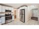 Modern kitchen featuring stainless steel appliances and white cabinetry at 1123 Redan Way, Stone Mountain, GA 30088