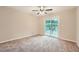 Bedroom with sliding door to private balcony and ceiling fan at 1123 Redan Way, Stone Mountain, GA 30088