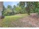 Spacious backyard with tiered landscaping and partial fence at 1123 Redan Way, Stone Mountain, GA 30088