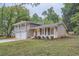 Two-story house with attached two-car garage and landscaped lawn at 1123 Redan Way, Stone Mountain, GA 30088