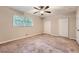 Well-lit bedroom featuring neutral walls and carpet, plus double closets at 1123 Redan Way, Stone Mountain, GA 30088