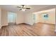 Open living and dining area with hardwood floors and neutral decor at 1123 Redan Way, Stone Mountain, GA 30088