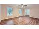 Living room with hardwood floors, neutral walls and access to other rooms at 1123 Redan Way, Stone Mountain, GA 30088