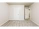 Bright bedroom with carpet flooring, a closet, and access to a hallway at 6393 Shadow Sq, Lithonia, GA 30058