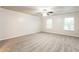 Large bedroom featuring carpet flooring and two large windows at 6393 Shadow Sq, Lithonia, GA 30058
