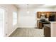 Eat-in kitchen with dark wood cabinets, granite countertops, and stainless steel appliances at 6393 Shadow Sq, Lithonia, GA 30058