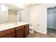 Clean bathroom with wood cabinets, a mirror and a shower/tub combo at 6393 Shadow Sq, Lithonia, GA 30058