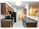 Modern kitchen with granite countertops, stainless steel appliances, and ample cabinet space at 6393 Shadow Sq, Lithonia, GA 30058