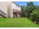 Spacious backyard with a deck and access to the house at 6393 Shadow Sq, Lithonia, GA 30058