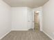 Bedroom with carpet flooring and access to hallway and another room at 6393 Shadow Sq, Lithonia, GA 30058