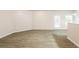 Bright living area with hardwood floors and access to back patio at 6393 Shadow Sq, Lithonia, GA 30058