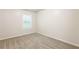 Well-lit bedroom with carpet flooring and a window at 6393 Shadow Sq, Lithonia, GA 30058