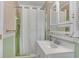 Clean bathroom with white vanity, shower, and light green walls at 3216 Guynelle Dr, Marietta, GA 30066