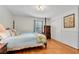 Spacious bedroom with hardwood floors, blue bedding, and a wooden bed frame at 3216 Guynelle Dr, Marietta, GA 30066