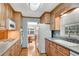 Updated kitchen with wood cabinets, granite countertops, and stainless steel appliances at 3216 Guynelle Dr, Marietta, GA 30066
