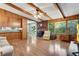 Gathering room features wood paneling, a brick fireplace, and a wood-burning stove at 3216 Guynelle Dr, Marietta, GA 30066