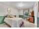 Charming bedroom with a floral bedspread and a vanity area at 3216 Guynelle Dr, Marietta, GA 30066