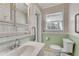 Simple bathroom with white vanity, toilet, and light green walls at 3216 Guynelle Dr, Marietta, GA 30066
