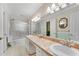 Bathroom with double vanity, tiled counters, and a shower/tub combo at 3216 Guynelle Dr, Marietta, GA 30066