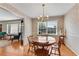 Bright dining room with hardwood floors, floral wallpaper, and a round table at 3216 Guynelle Dr, Marietta, GA 30066