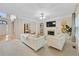 Living room boasts a fireplace, ample seating, and natural light at 230 Ridge Bluff Ln, Suwanee, GA 30024