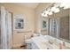 Full bathroom with tub/shower combo, and neutral tile flooring at 403 Pebblebrooke Ln, Canton, GA 30115