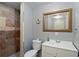 Basement bathroom with a shower, toilet, and white vanity at 403 Pebblebrooke Ln, Canton, GA 30115