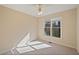 Spacious bedroom with ceiling fan and large window at 403 Pebblebrooke Ln, Canton, GA 30115